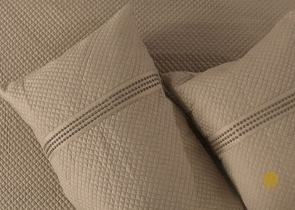 Premium quilted 8-piece bedding set by The Gharnish, featuring soft, stylish comforter and pillowcases for a cozy bedroom look.