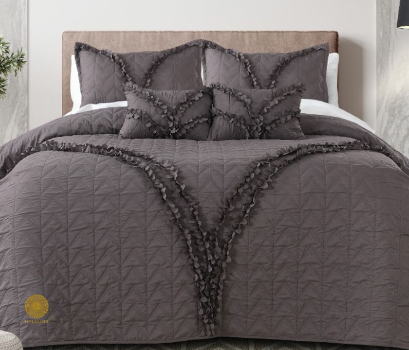Aqua-colored designer bedding set by The Gharnish featuring 5 pieces with elegant patterns and coordinated bedding decor.