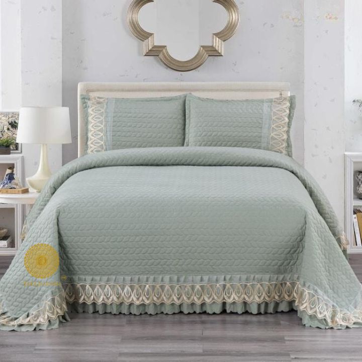 Astria Premium quilted and laced bedcover by The Gharnish, featuring intricate quilting and lace details on a luxurious bedding.