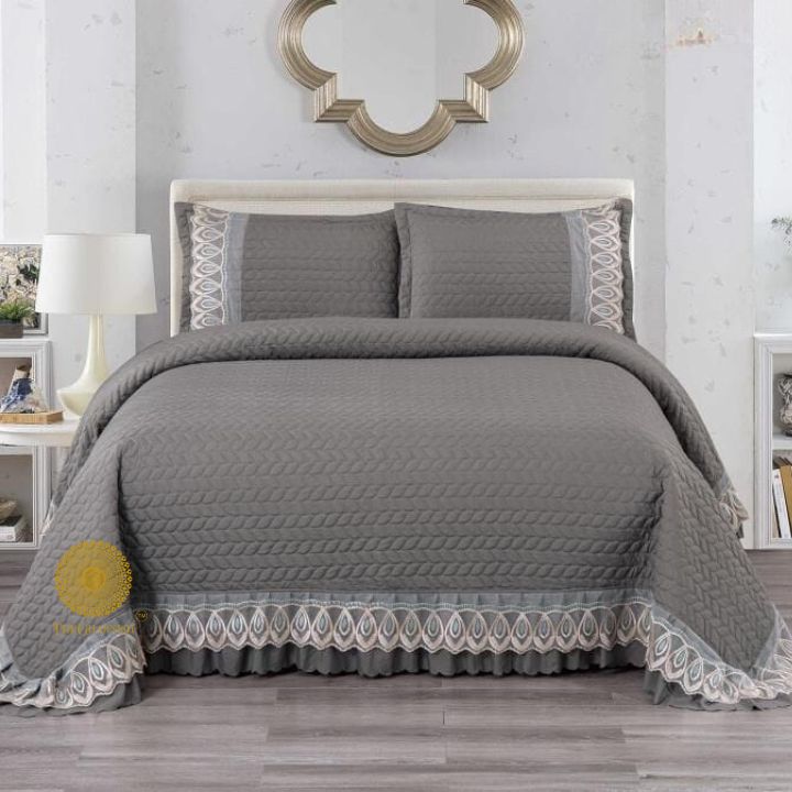 Astria Premium quilted and laced bedcover from The Gharnish, featuring intricate stitching and elegant design for luxurious bedding.