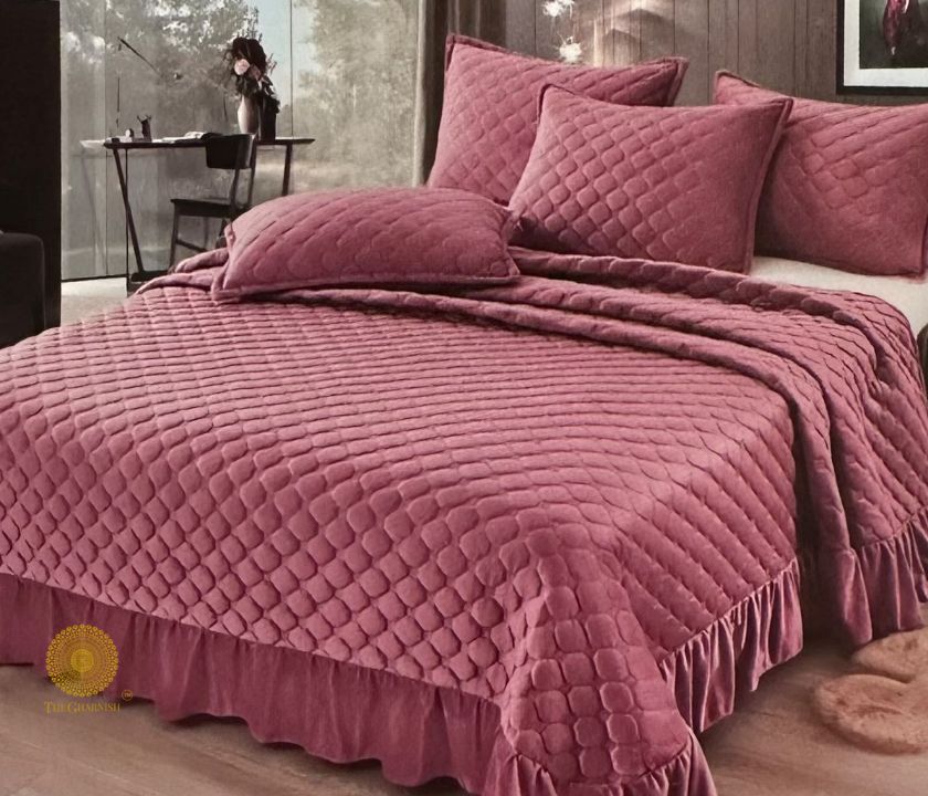Velvet warm quilted bedcover set with frill detailing by The Gharnish, stylish bedding for a cozy bedroom look.