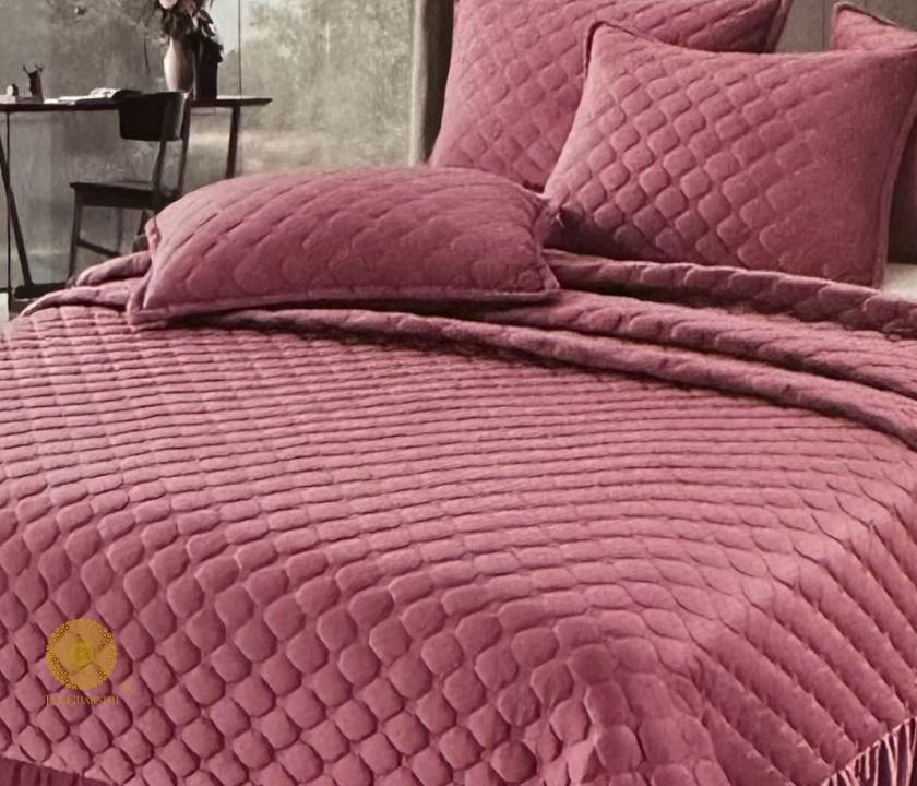 Beautiful velvet warm quilted bedcover set with frill details from The Gharnish, elegant bedding for a cozy bedroom look