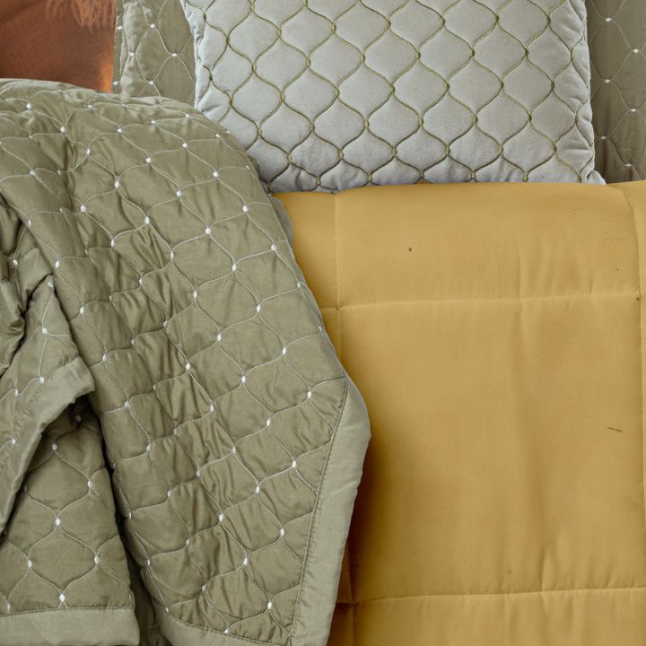 Luxury 5-piece quilted bedding set by The Gharnish including bedcover, pillow, and cushion covers in elegant design.