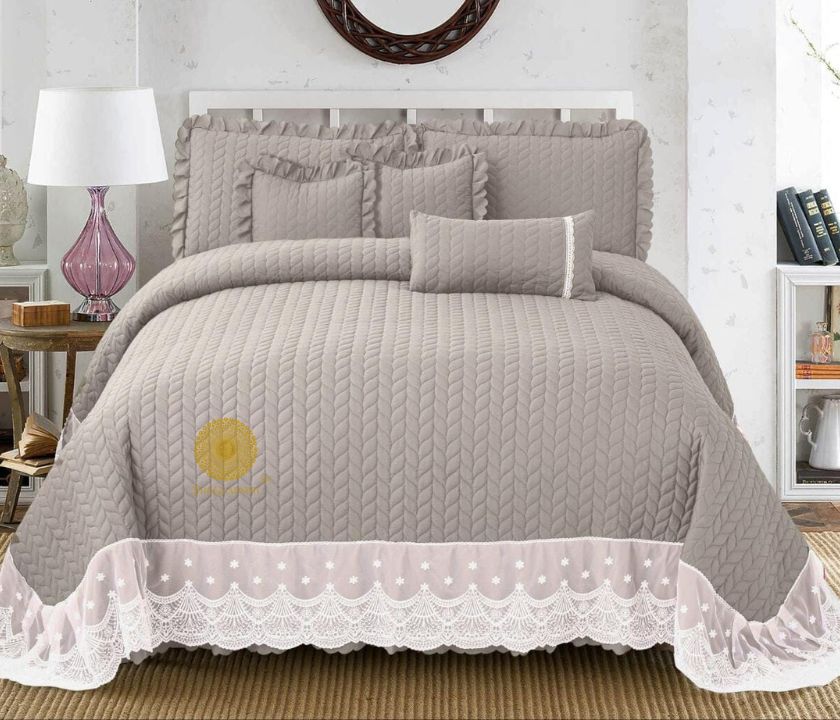 Luxury quilted king size bedcover set by The Gharnish, featuring a stylish bedding design with six matching pieces.