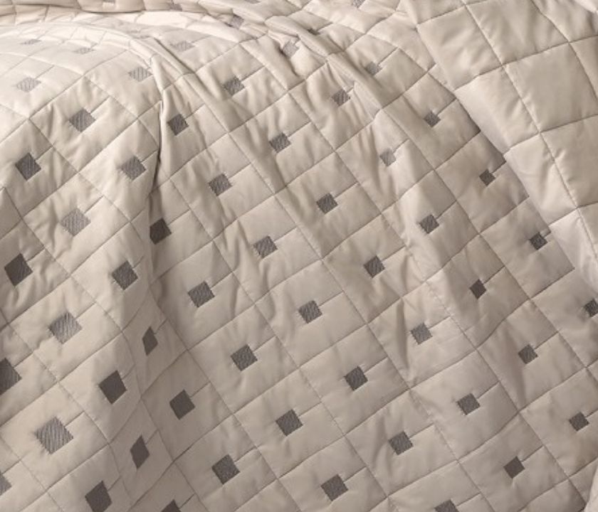 Luxury quilted bedcover 6-piece bedding set by The Gharnish, featuring elegant stitching and plush fabric for a stylish bedroom look.