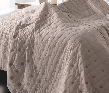 Luxury quilted bedding set by The Gharnish, including 6 pieces with elegant stitched design for sophisticated bedroom decor.