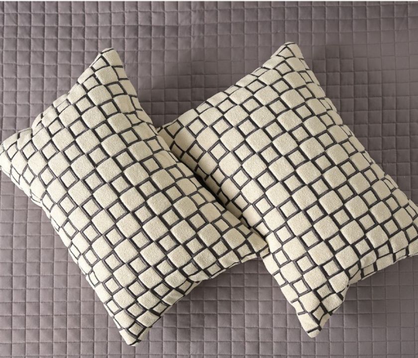 Luxury quilted bedcover 6-piece bedding set by The Gharnish with intricate quilting and elegant design in a cozy, stylish bedroom setting.