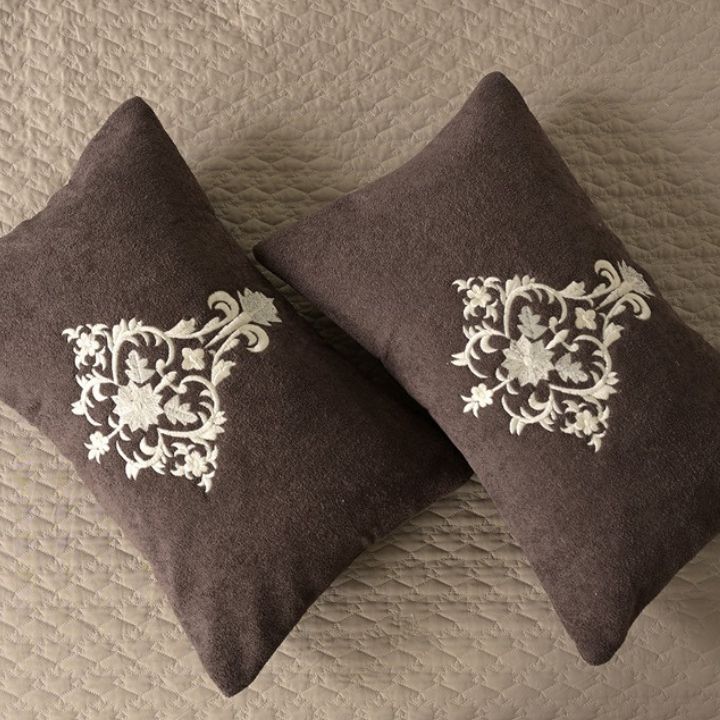 Mughlai quilted bedding set of 5 by The Gharnish, featuring traditional patterned comforters and pillowcases on a bed.