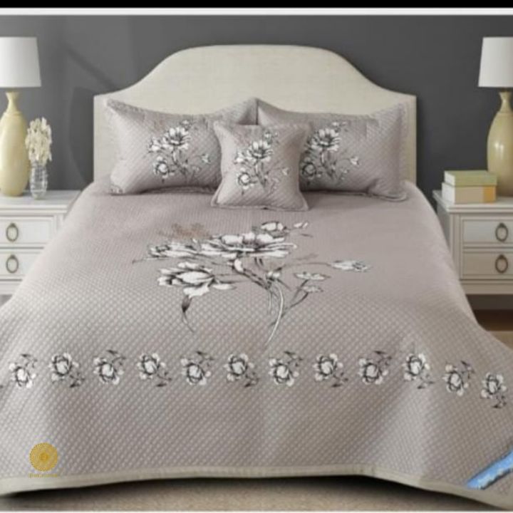 Premium quilted bedding 4-piece set by The Gharnish featuring soft, plush fabric and elegant stitching for cozy bedroom decor.