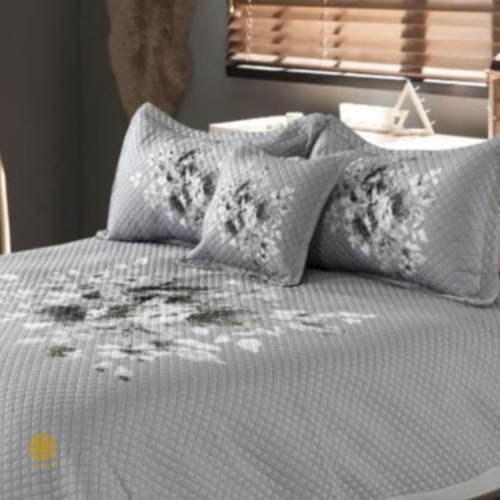 Premium quilted bedding 4-piece set by The Gharnish featuring soft, cozy fabric with intricate quilting details in neutral tones.