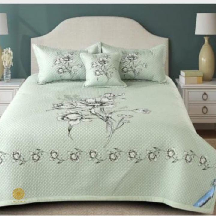 Luxurious quilted bedding 4-piece set by The Gharnish featuring soft, quilted fabric and coordinated pillowcases for a cozy bedroom look.