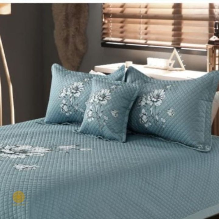 Premium quilted bedding 4-piece set by The Gharnish, featuring soft, patterned fabric with stitched quilting for comfort and style.