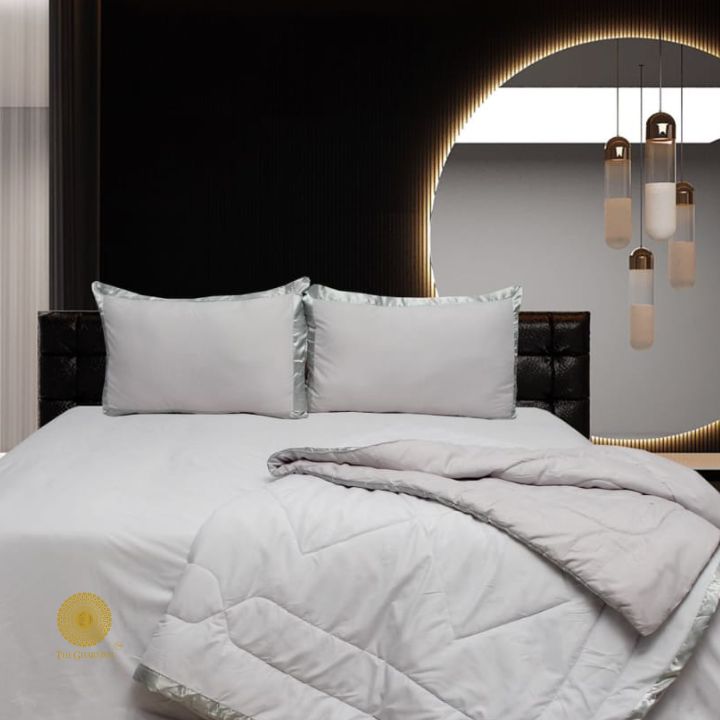 Premium reversible comforter set by The Gharnish with satin border, featuring soft, luxurious bedding design and elegant detailing.