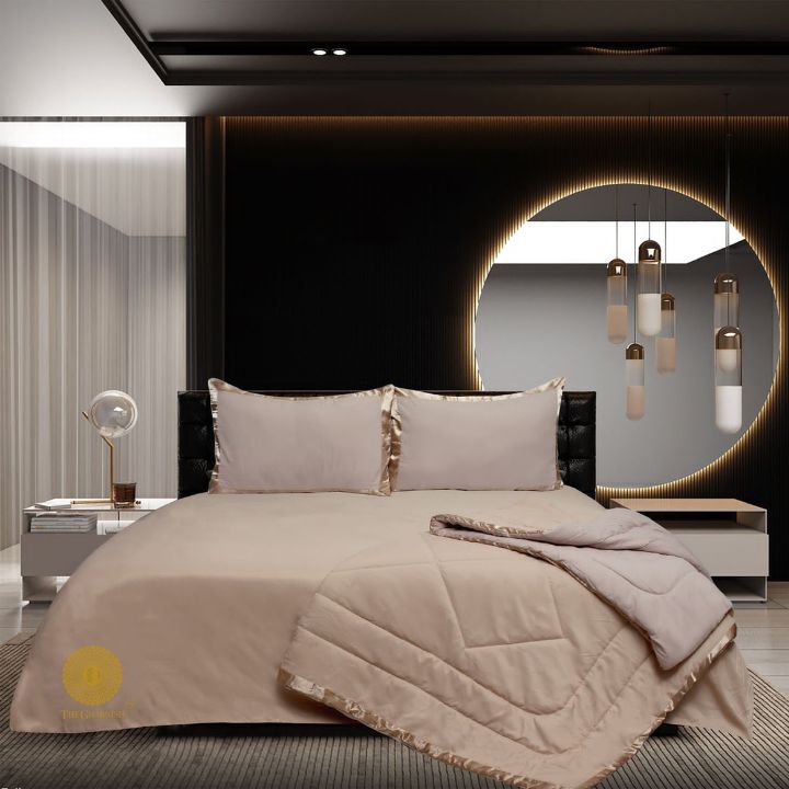 Premium reversible comforter set by The Gharnish featuring a satin border, soft bedding with elegant design.