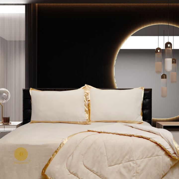 Premium reversible comforter set by The Gharnish featuring a satin border, showcasing luxurious bedding with elegant design.
