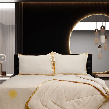 Premium reversible comforter set by The Gharnish featuring a satin border, showcasing luxurious bedding with elegant design.