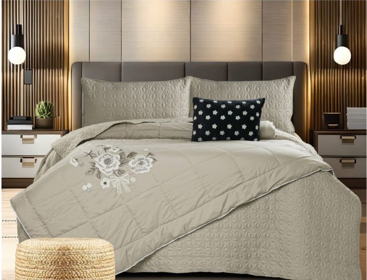 Set of five quilted bedding bedcovers with embroidered orchid designs by The Gharnish, featuring elegant, decorative patterns.