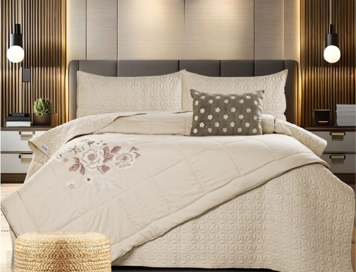 Set of five quilted bedding pieces with embroidery, orchid design, by The Gharnish, including bedcover and matching accessories.