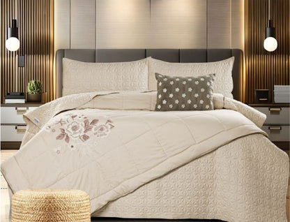 Set of five quilted bedding pieces with embroidery, orchid design, by The Gharnish, including bedcover and matching accessories.