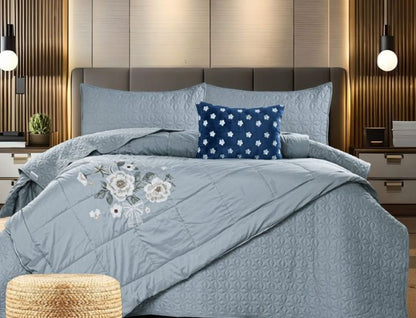 Set of five quilted bedding bedcovers with embroidered orchid designs by The Gharnish, featuring elegant, decorative patterns.