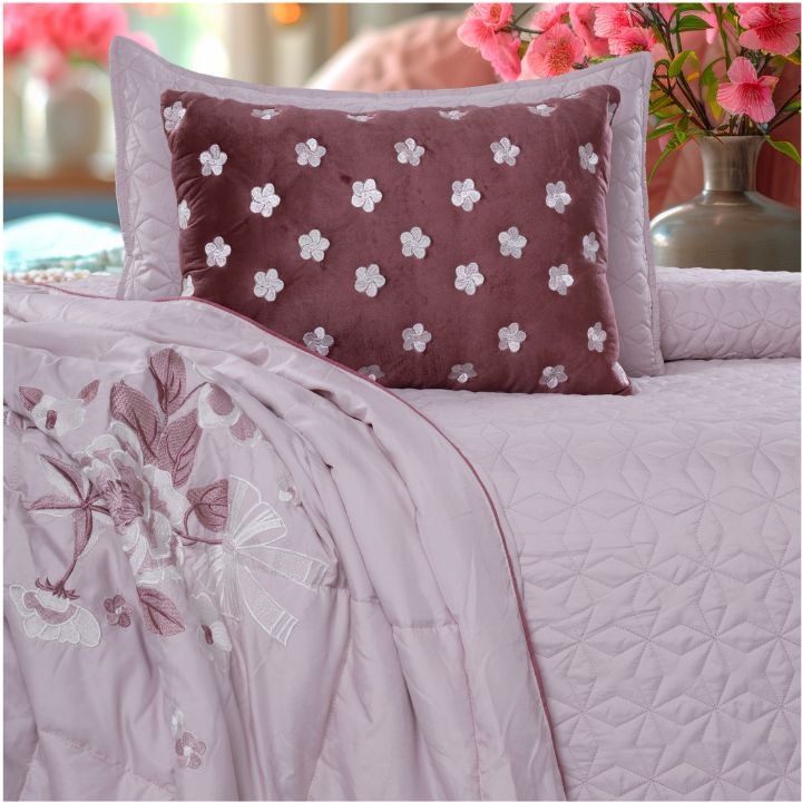 Set of five quilted bedding bedcovers with embroidered orchid designs by The Gharnish, elegant and decorative for bedroom decor.