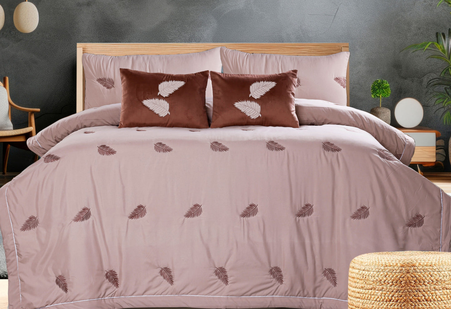 The Gharnish Royale 6-piece all-weather comforter set with elegant embroidery, showcasing soft bedding and decorative stitching.