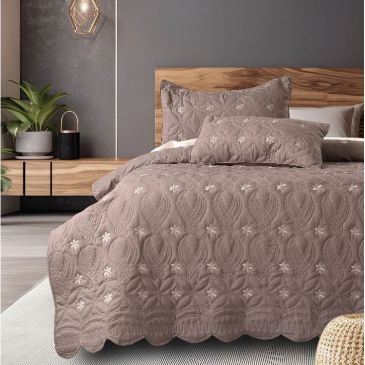 The Gharnish Swrill quilted bedding set of 3 with unique design, featuring textured patterns and soft fabric for a stylish bedroom look.