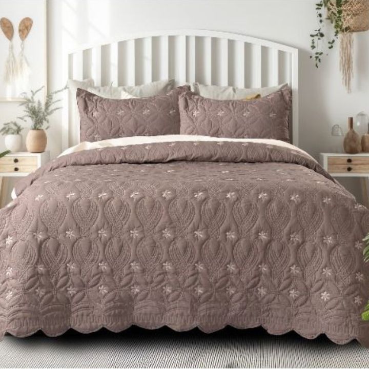 Set of three quilted bedding bedcover sets by The Gharnish with unique stitched designs, ideal for stylish bedroom decor.