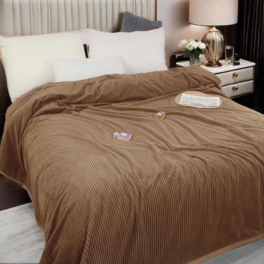 Double bed AC blanket by The Gharnish, soft and cozy blanket draped over a bed for cooling comfort in warm weather.