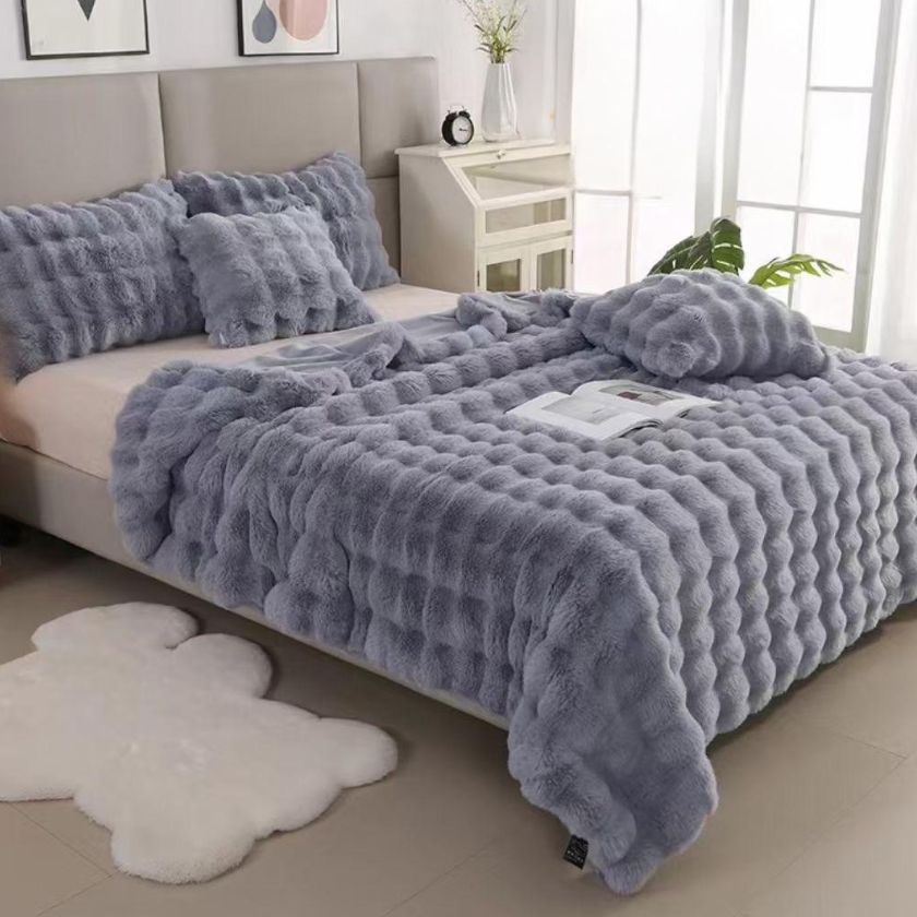 Luxury rabbit fur blanket by The Gharnish, ultra warm double bed winter quilt with plush, soft fur for cozy comfort.