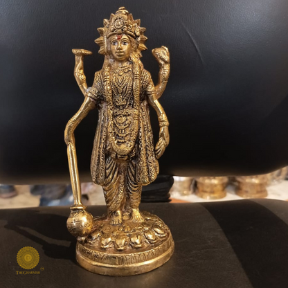 Brass statue of Chakradhari Lord Vishnu from The Gharnish, depicting Lord Vishnu holding his discus in a detailed brass sculpture.