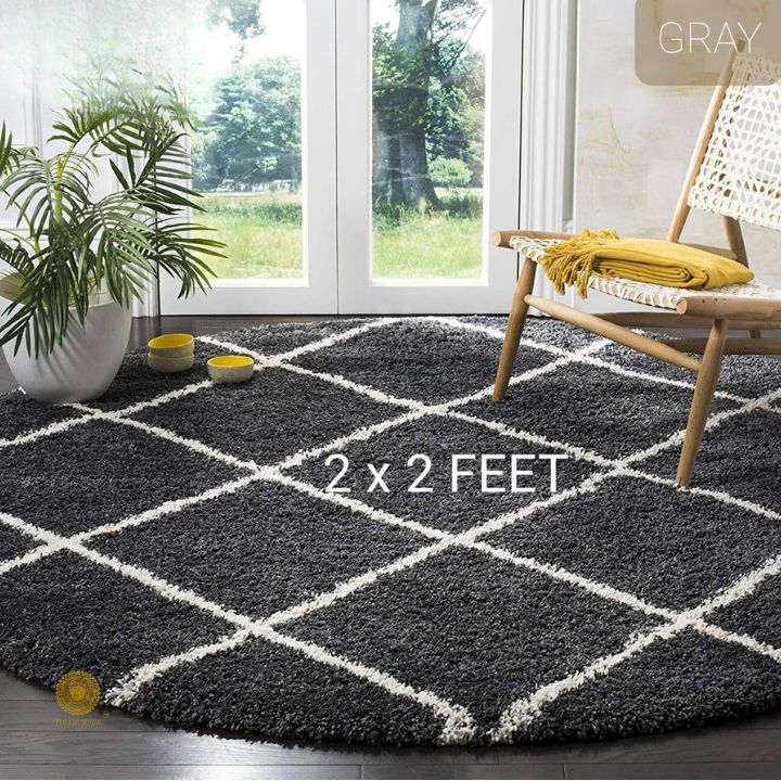 Beige modern round-shaped bedroom or dining room rug by The Gharnish, 2x2 feet, soft textured carpet for stylish interior decor.