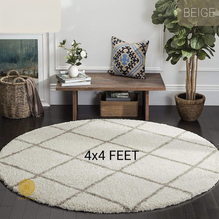 Beige modern round-shaped carpet by The Gharnish, ideal for bedroom or dining room, measuring 2x2 feet.