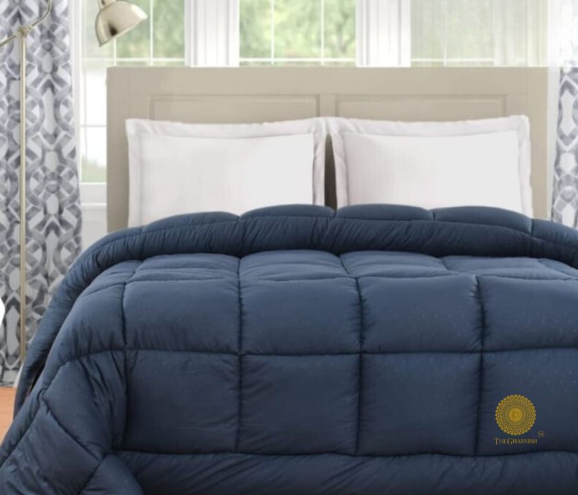 Navy blue Supersoft Siliconised Micro Fabric All-Season Comforter by The Gharnish, shown on a bed for cozy sleeping comfort.