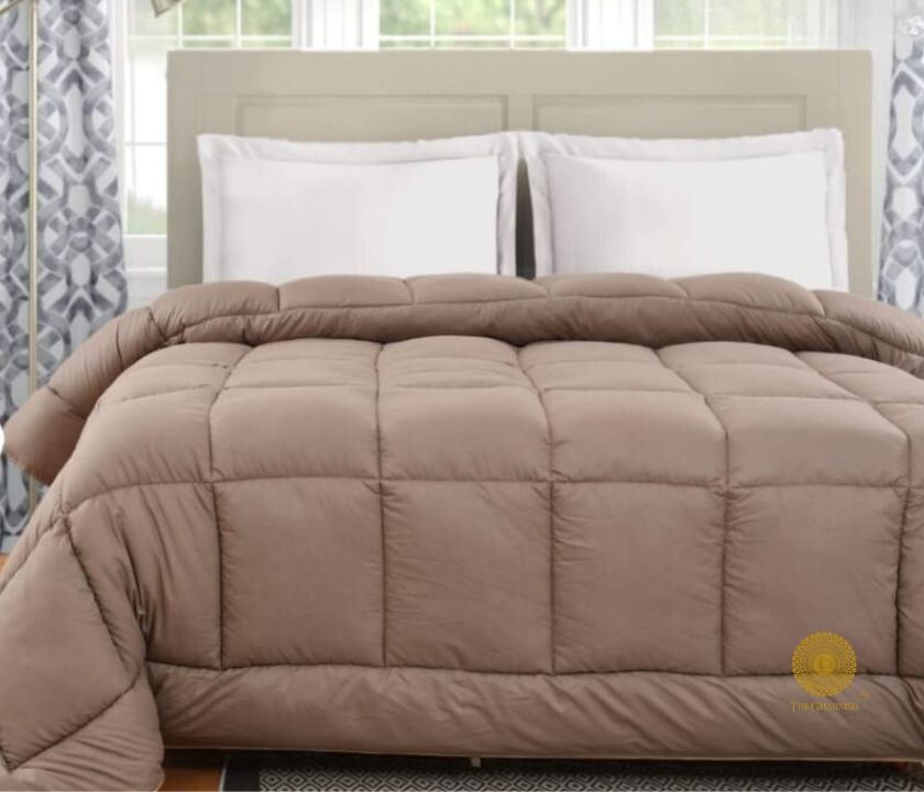 Navy blue Supersoft Siliconised Micro Fabric All Season Comforter by The Gharnish, displayed on a bed for cozy sleep.