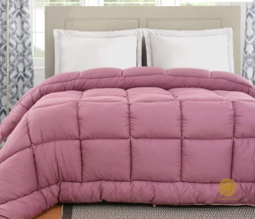 The Gharnish navy blue all-season comforter made of supersoft siliconized microfabric, designed for cozy, year-round comfort.
