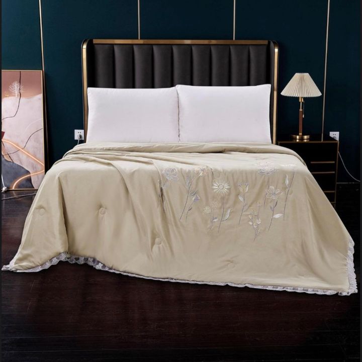 Luxury solid comforter with embroidery from The Gharnish, featuring elegant design for summer collection.