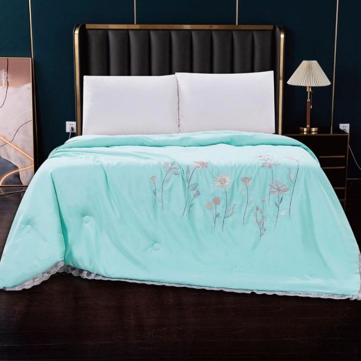 Charming luxury solid comforter with embroidery from The Gharnish Summer Collection, featuring elegant design and soft fabric.