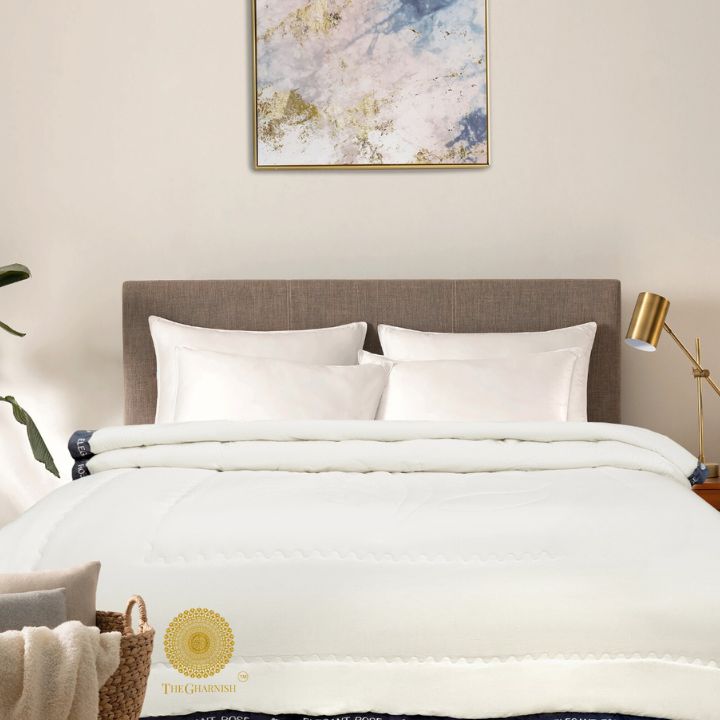 Elegant The Gharnish comforter with intricate embroidery, showcasing a luxurious and stylish bedspread design.