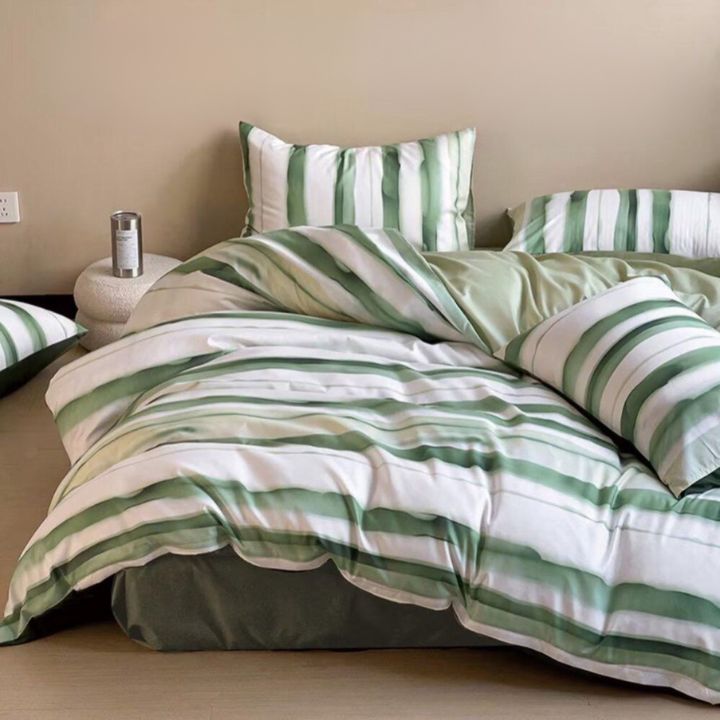 The Gharnish Palette Stripe 4-piece comforter set with striped pattern, includes comforter, pillow shams, and sheets.