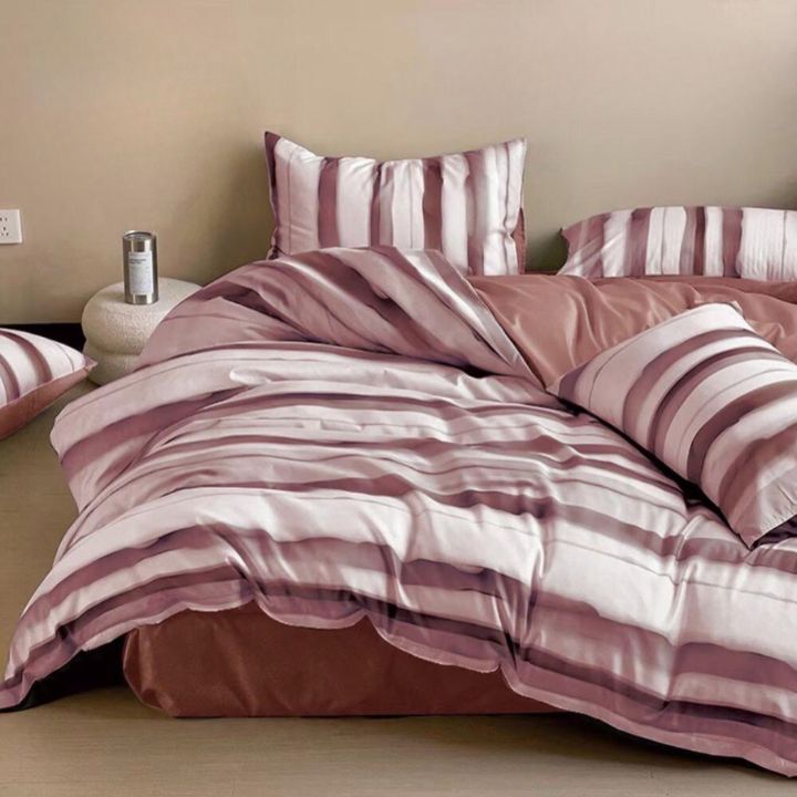 The Gharnish Palette Stripe 4-piece comforter set featuring a multicolored striped pattern on a cozy bedding comforter.