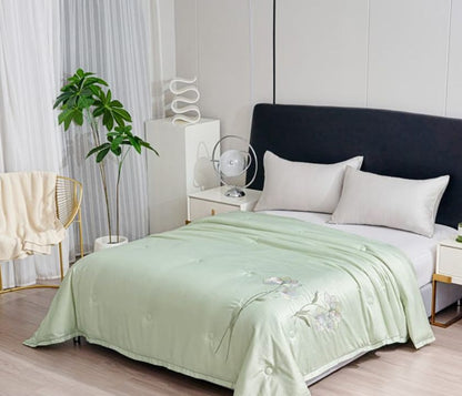 The Gharnish Ulta Luxurious Series imported all-weather comforter shown in a cozy bedroom setting with plush fabric.