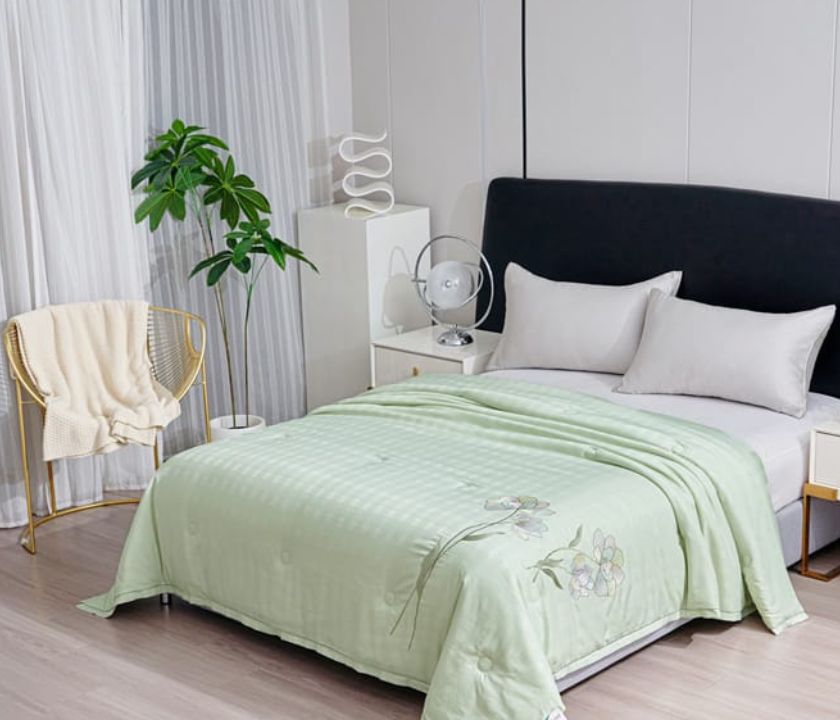 The Gharnish Ulta Luxurious Series imported all-weather comforter in a cozy, plush style with a soft fabric finish.