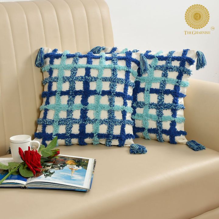 Set of two soft white and blue tassels cushions by The Gharnish, 16x16 inches, featuring decorative tassel details.