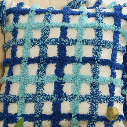 Set of two soft white and blue tassel cushions by The Gharnish, 16x16 inches, featuring decorative tassels and plush fabric.