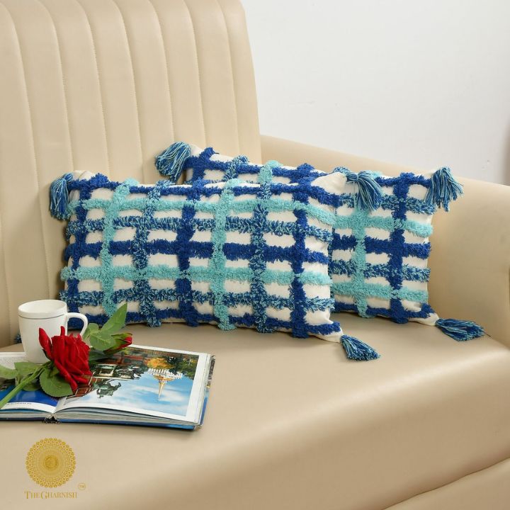 Set of two soft white and blue tassels cushions by The Gharnish, 16x16 inches, featuring decorative tassel accents.