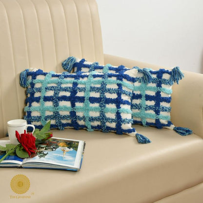 Set of two soft white and blue tassels cushions by The Gharnish, 16x16 inches, featuring decorative tassel accents.