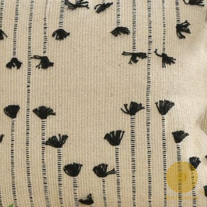 Set of two handcrafted 16x16-inch cushion covers with tassels by The Gharnish, featuring decorative design and elegant texture.