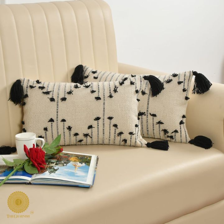 Set of two handcrafted cushion covers with tassels by The Gharnish, 16x16 inches, stylish and decorative for living spaces.