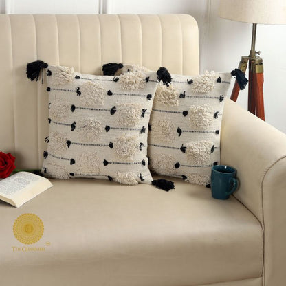 Set of two handcrafted cushion covers with tassels by The Gharnish, 16x16 inches, stylish and decorative for home decor.